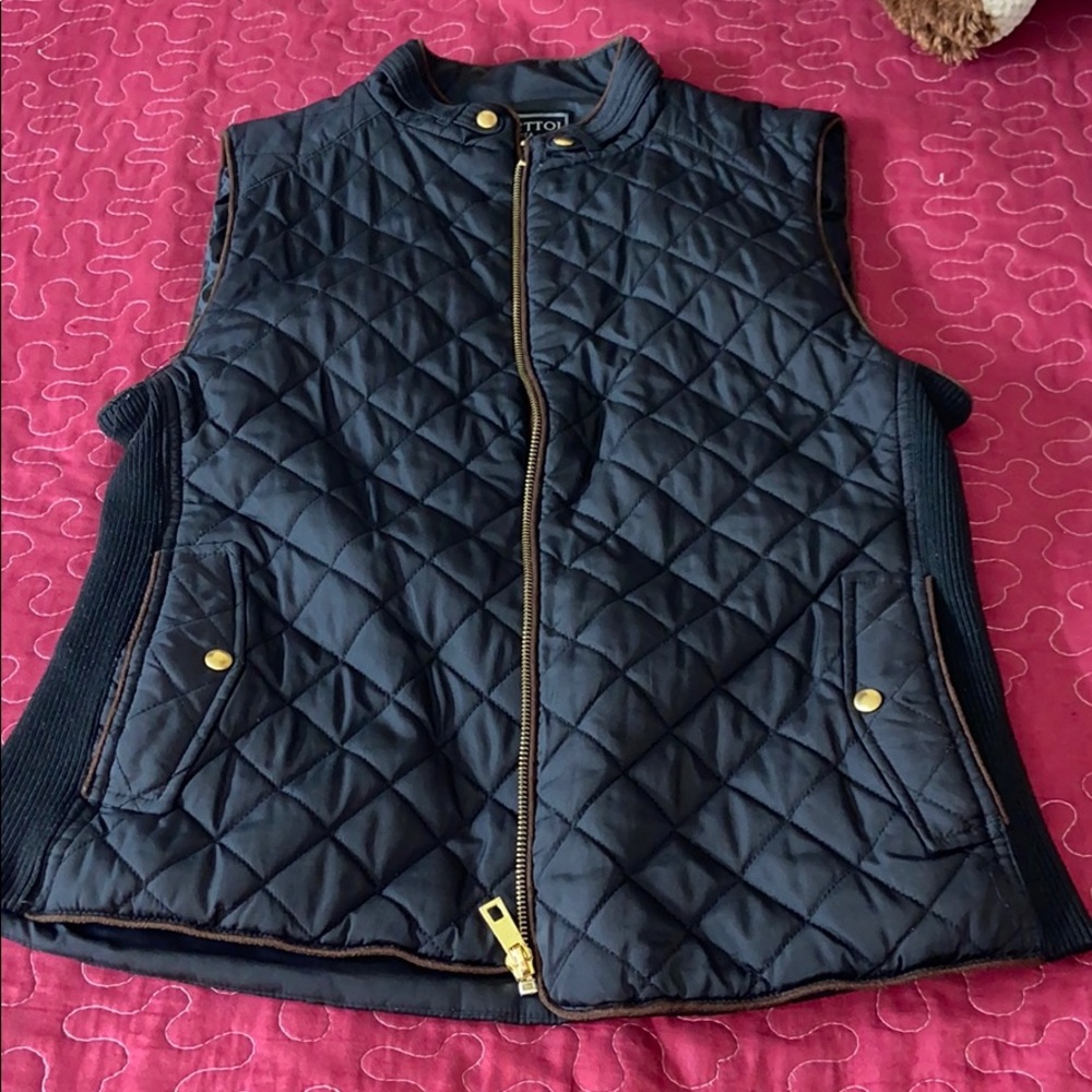 2 different vests black one $15 blue one $20